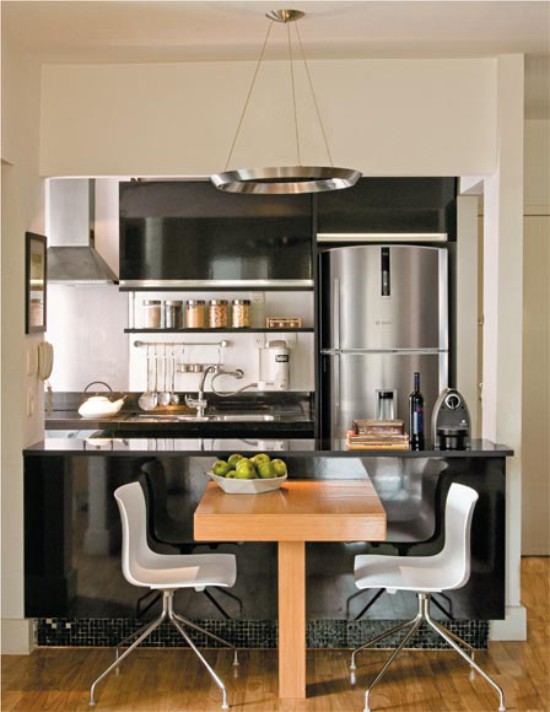 Dining table in a small high-tech kitchen-living room