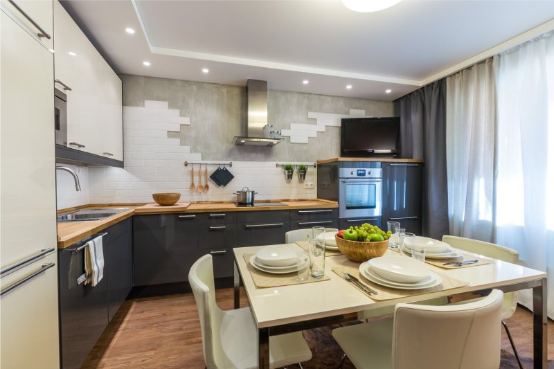 Interior of modern kitchen with wooden countertop