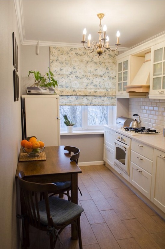 Roman curtains in the interior of a small kitchen