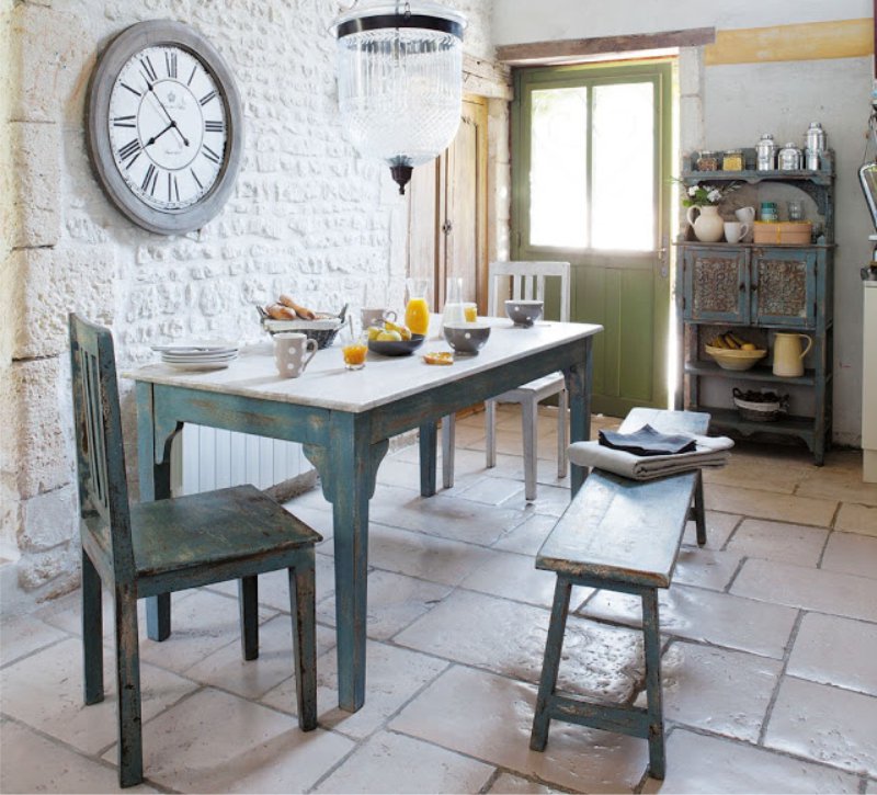 Provence style kitchen interior with clock on the wall