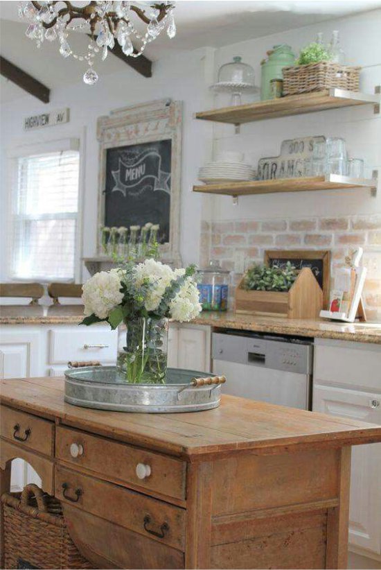 Brick apron in the interior of the kitchen in the style of Provence