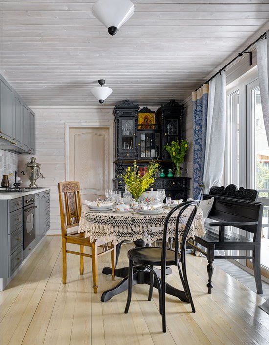 Black furniture in the interior of the kitchen in the country