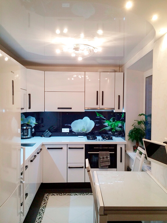 Glossy stretch ceiling in the kitchen in Khrushchev