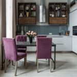 Loft-style kitchen with purple upholstered chairs