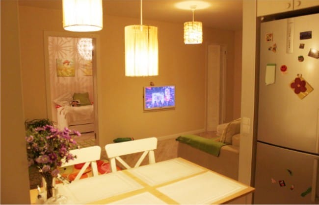 Small kitchen in Khrushchev with a niche for a refrigerator - view of the living room