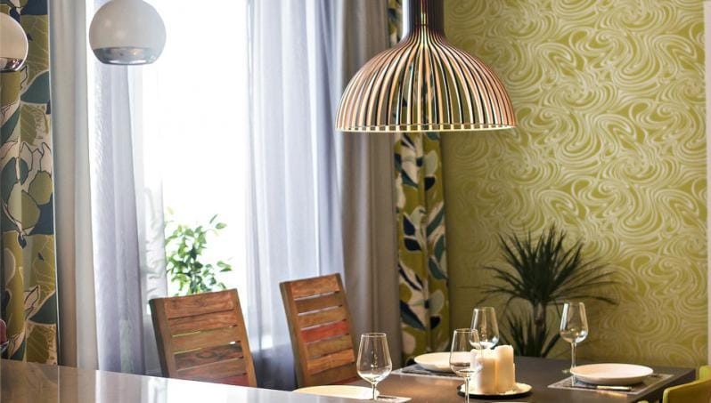 Tulle and two curtains in the interior of the kitchen