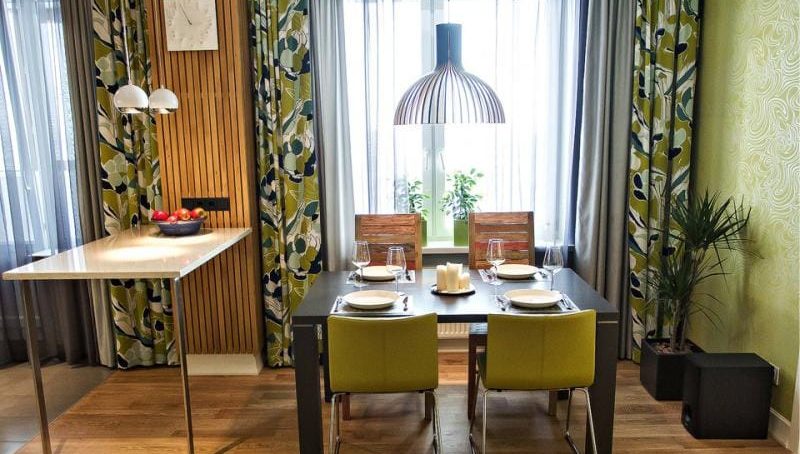 Tulle and two curtains in the interior of the kitchen