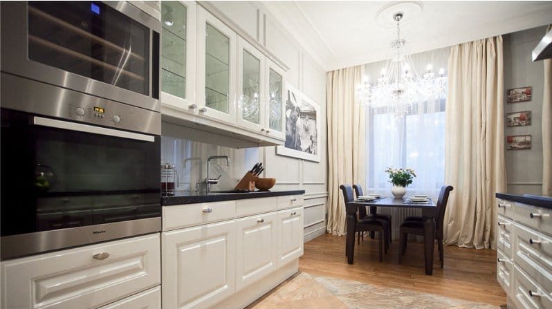 Tulle with curtains in the interior of a classic kitchen