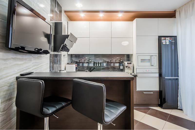 White kitchen with black appliances