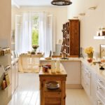 White curtains in the interior of the kitchen-dining room in the style of Provence