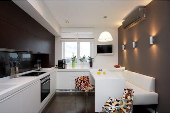 Sconce in the interior of a small kitchen with dark walls