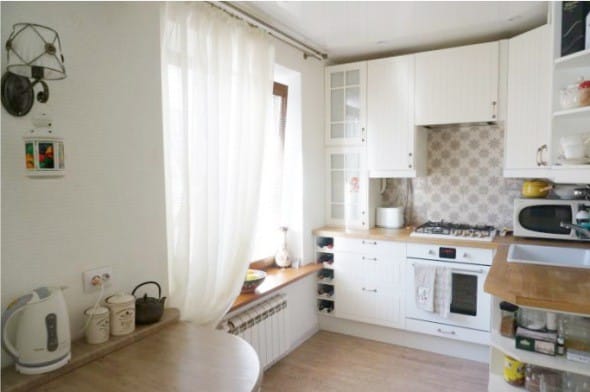 Sconce in the interior of a small kitchen without a chandelier