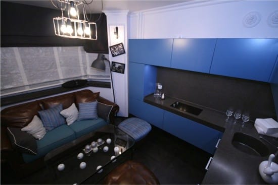 Sofa in the interior of the kitchen with a bay window