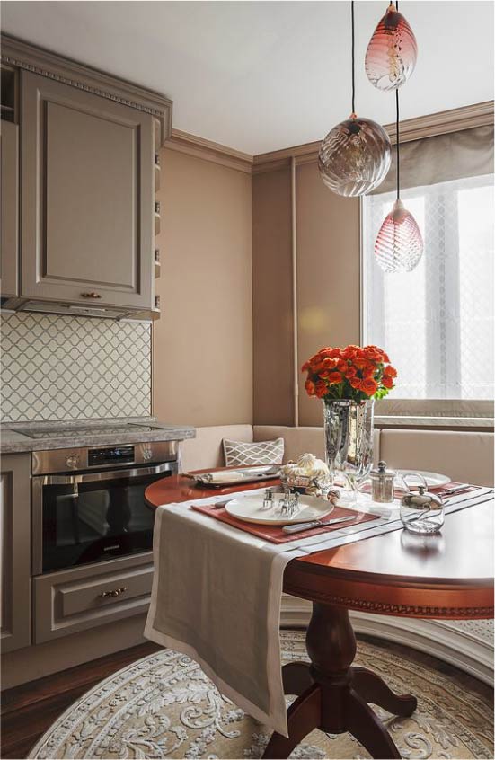 Oval table in the kitchen-dining room with a bay window