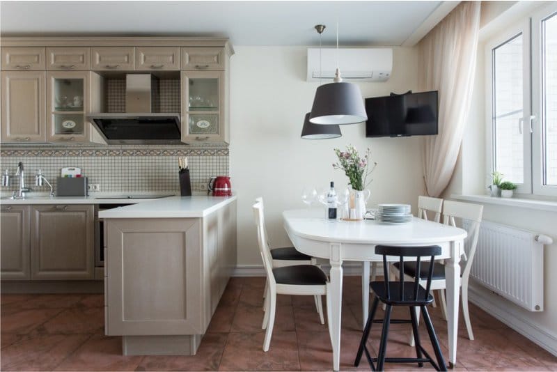 Oval table in the interior of the kitchen