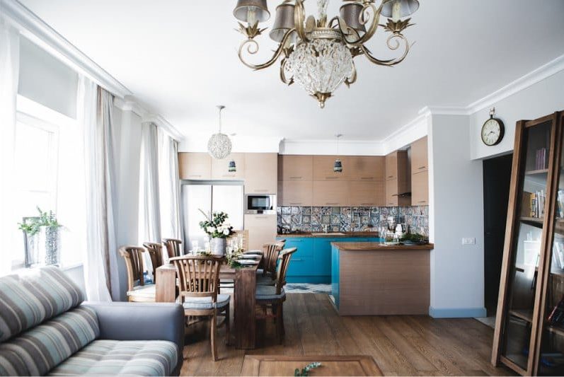 Wooden teak table in the kitchen-living room interior