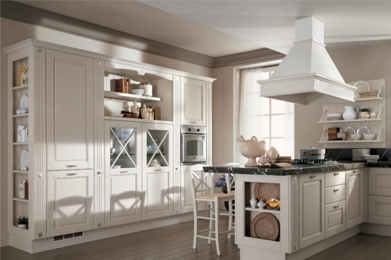 Two-level ceiling with moldings in the kitchen in a classic style