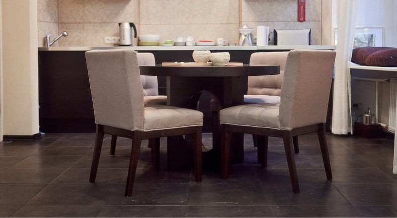 Round wooden table in the kitchen interior