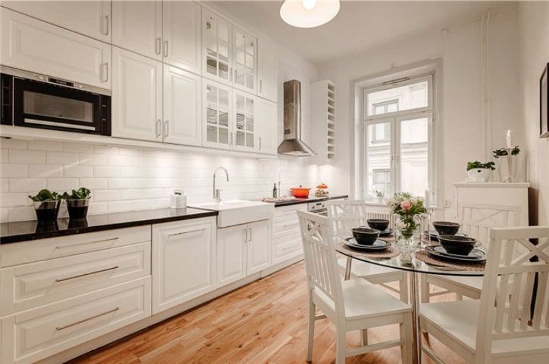 Round glass table in the kitchen interior