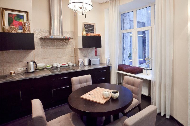 Round table in the interior of a small kitchen