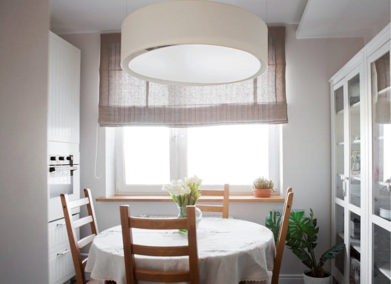 Round table in the interior of a small kitchen