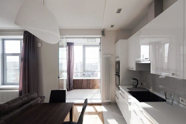 Kitchen with a balcony and a glass door