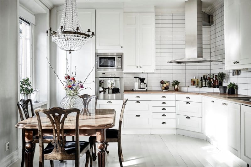 Square wooden table in the interior of a small kitchen