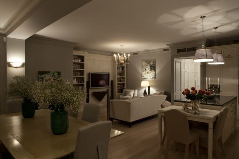 The ceiling in the interior of the kitchen-living room in a classic style.