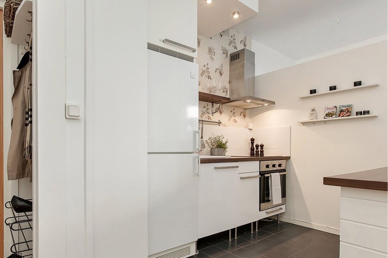 Kitchen in a studio apartment with integrated appliances