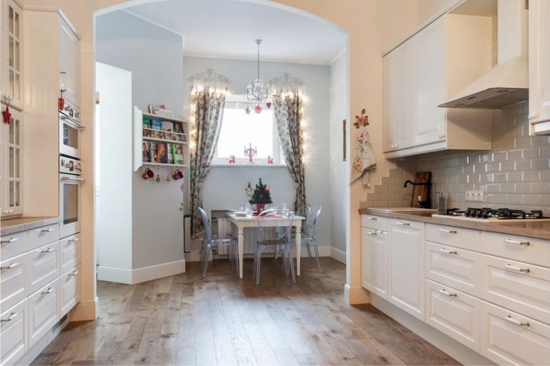 Gray apron in the interior of the white kitchen