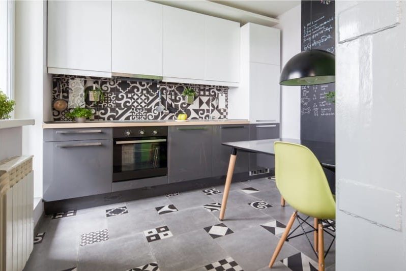 Gray floor of tiles in the interior of the kitchen