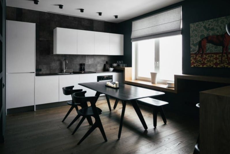 The combination of black and gray in the interior of the kitchen