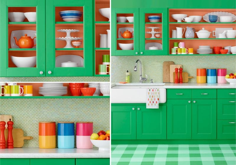 Green kitchen with orange accents