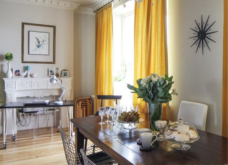 Yellow curtains in the interior of the kitchen