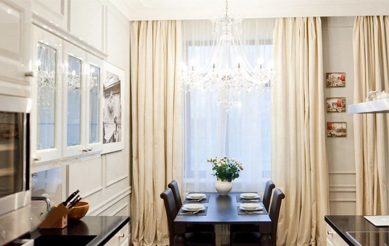 White and beige in the interior of the kitchen in a classic style