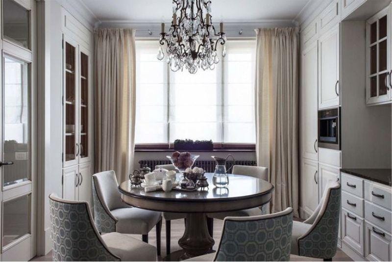 White and beige in the interior of the kitchen in a classic style