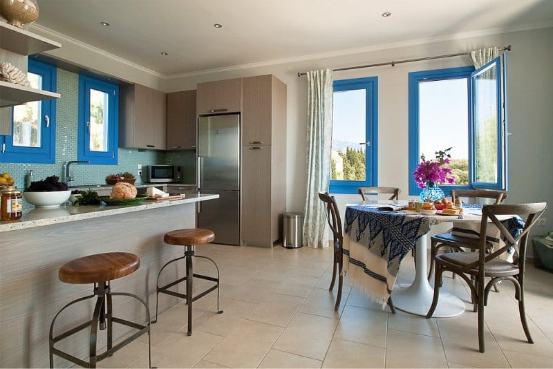 Mediterranean-style beige kitchen with blue accents