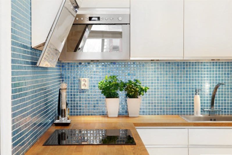 Apron of blue color in an interior of kitchen