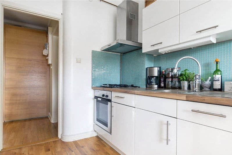 Apron of blue color in an interior of kitchen