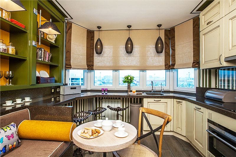 Cafe style kitchen interior with two dining tables