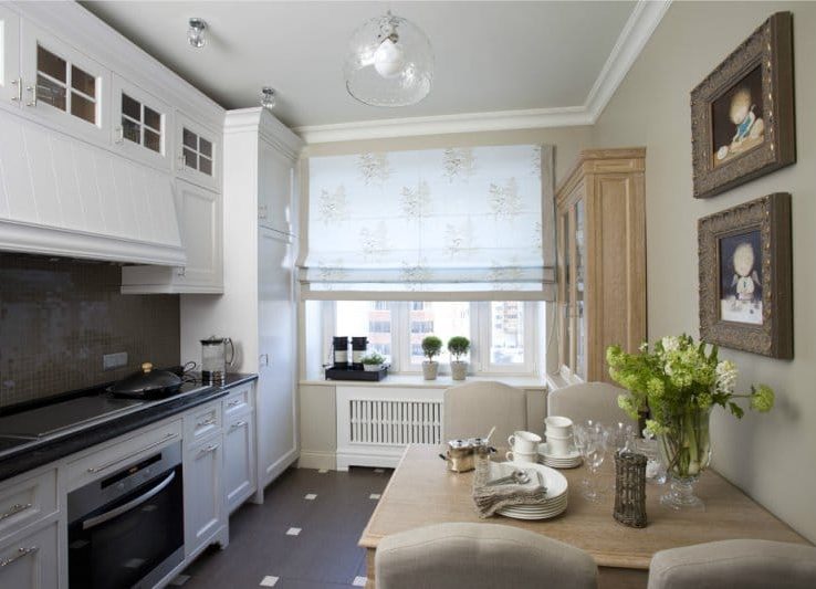 Roman curtains in the interior of a small kitchen