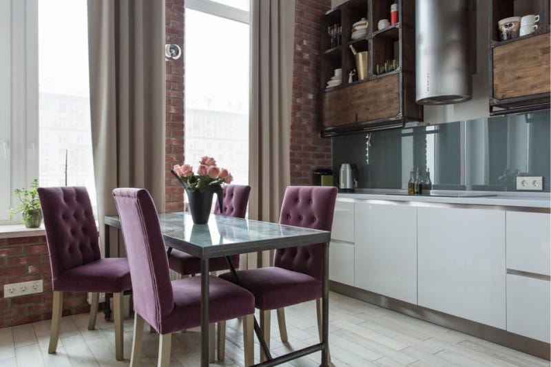 Loft-style kitchen with purple upholstered chairs