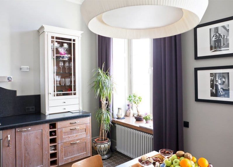 Neoclassical style kitchen with dark purple curtains