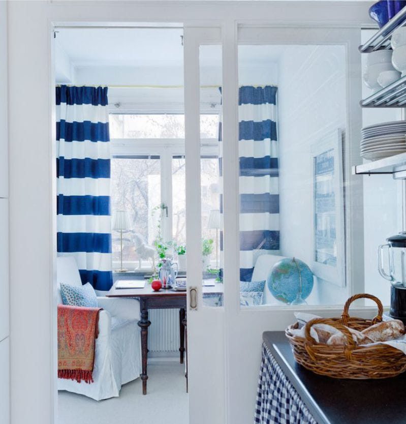 curtains in the interior of the kitchen in the marine style