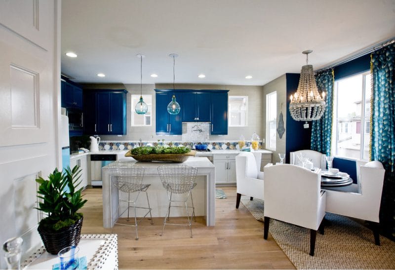 Blue curtains in the interior of the kitchen