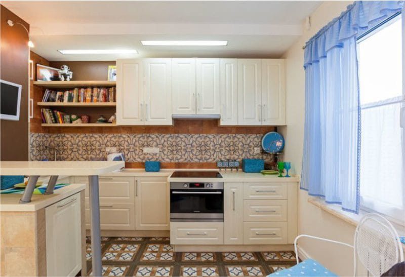 Blue curtains in the interior of the kitchen