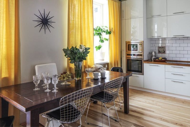 Clock in the interior of the kitchen in the Scandinavian style