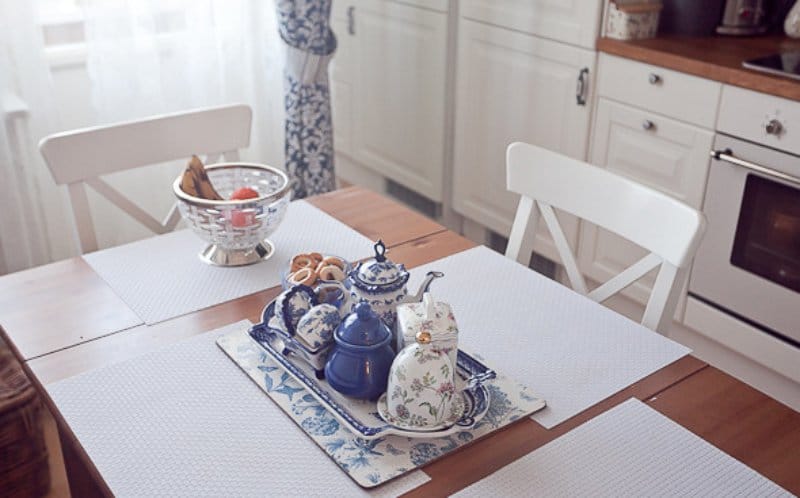 The interior of a small kitchen in the style of Gzhel