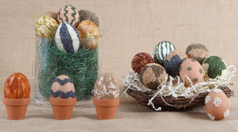 Easter eggs decorated with cereals and spices