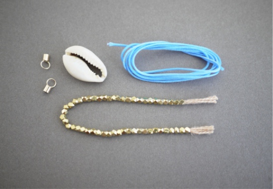 Cowry shell, silk lace, beads from the old bracelet and limit switches